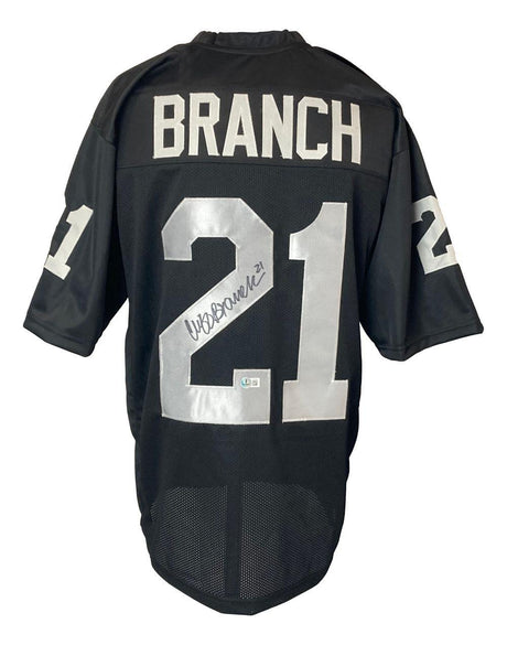 The Sports Integrity Cliff Branch Oakland Signed Black Football Jersey BAS features "BRANCH" and silver number 21 on the back with signatures on the number, plus 21 on both sleeves.
