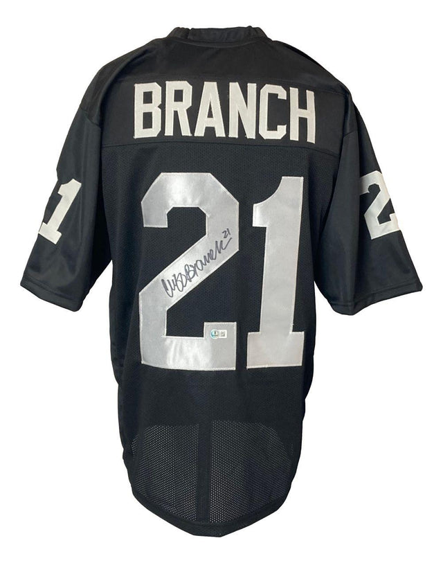 The Sports Integrity Cliff Branch Oakland Signed Black Football Jersey BAS features "BRANCH" and silver number 21 on the back with signatures on the number, plus 21 on both sleeves.