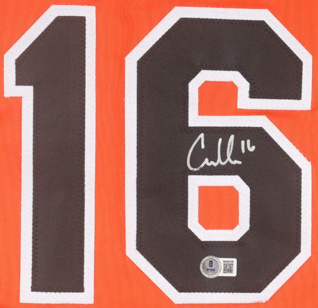 The Coby Mayo Baltimore Signed Orange Baseball Jersey by Sports Integrity features a black number 16 with a white border on an orange fabric. A white autograph appears on the number 6, with a small authenticity sticker below it.