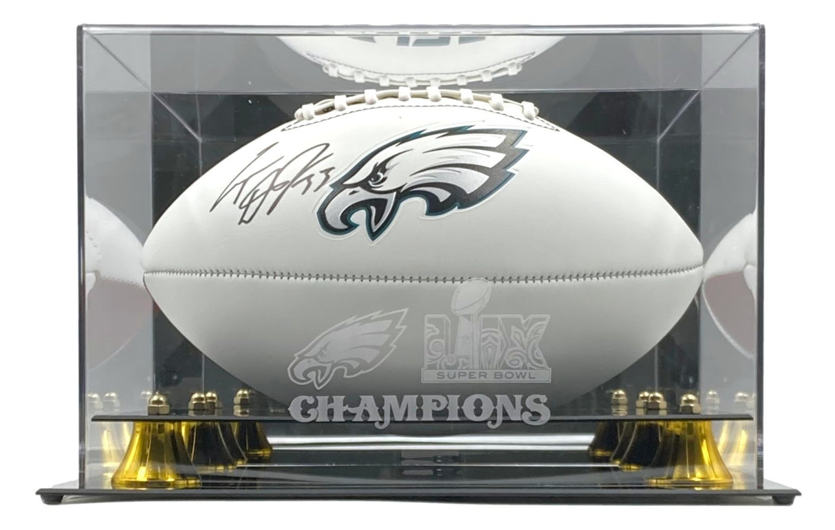 A Cooper Dejean signed Eagles logo football from Sports Integrity is showcased in a Fanatics case featuring the Super Bowl 59 LIX logo and the word CHAMPIONS on the front.
