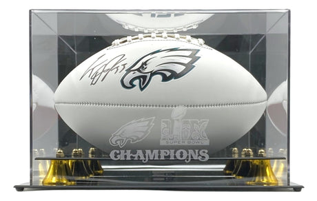 A Cooper Dejean signed Eagles logo football from Sports Integrity is showcased in a Fanatics case featuring the Super Bowl 59 LIX logo and the word CHAMPIONS on the front.