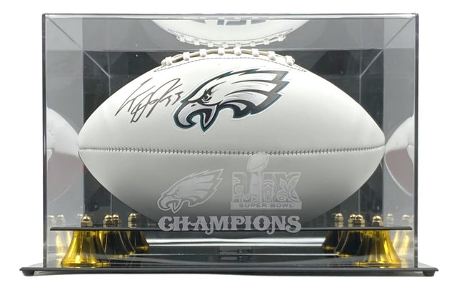 A Cooper Dejean signed Eagles logo football from Sports Integrity is showcased in a Fanatics case featuring the Super Bowl 59 LIX logo and the word CHAMPIONS on the front.