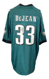 A green Philadelphia Eagles Nike Game Jersey by Sports Integrity featuring Cooper DeJean’s name and signed number 33 in black ink, with the Eagles logo on both sleeves.