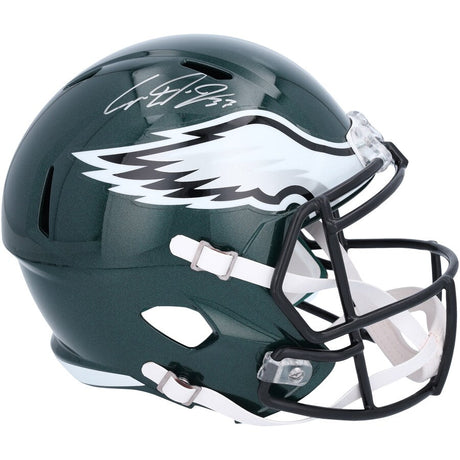 The Cooper DeJean Signed Philadelphia Eagles Full Size Replica Speed Helmet by Sports Integrity features a dark green design with the team's white and silver eagle wing logo and a white autograph on top.