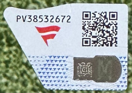 A Cooper Kupp Signed Framed 16x20 Rams Photo vs Giants by Sports Integrity features a sticker (PV38532672) with a red F, QR code, and metallic security on a white-blue pattern over a green textured background.