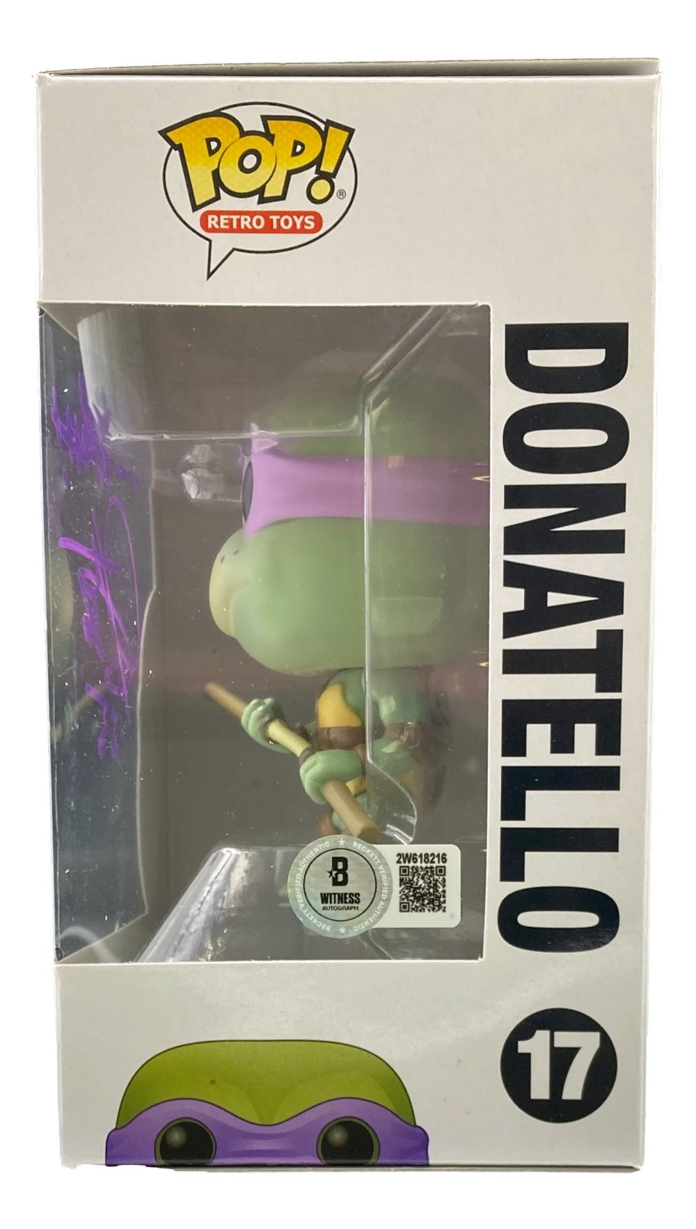 A Corey Feldman signed Teenage Mutant Ninja Turtles Funko Pop #17, branded by Sports Integrity and labeled "God Bless" with a BAS certification sticker, is shown in its box from the side.