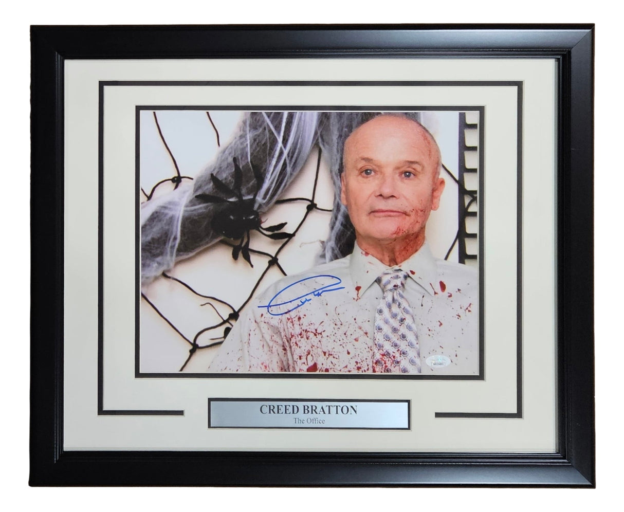 The Sports Integrity Creed Bratton Signed Framed 11x14 "The Office" Creed Bloody Shirt Photo (JSA ITP) features Creed in a blood-splattered shirt with a spider web, autographed with a nameplate.