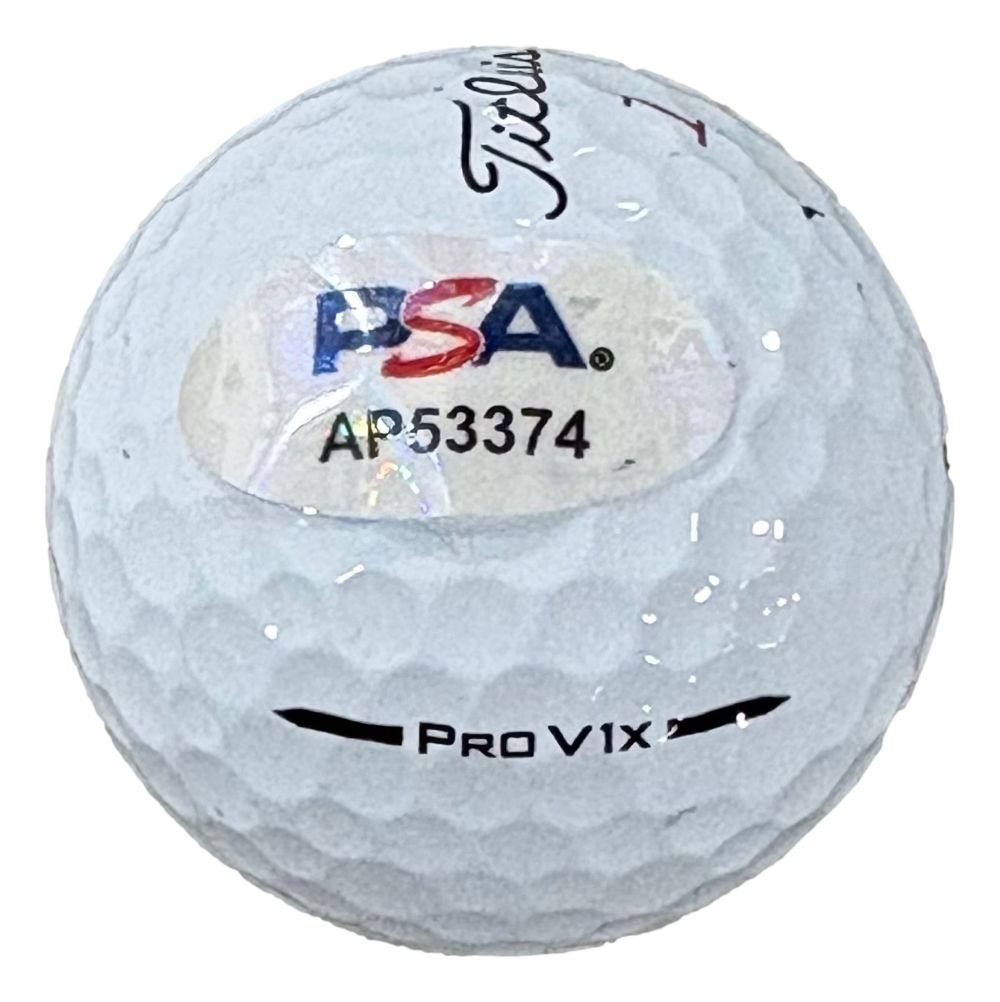 A John Daly Signed Titleist Golf Ball by Sports Integrity, featuring a PSA/DNA authentication sticker labeled AP53374.