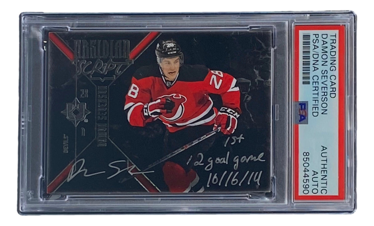 Sports Integrity Damon Severson Signed 2015 Upper Deck #OS-DA Devils hockey card in PSA/DNA holder, featuring handwritten notes: "1st," "2 goal game," and "10/16/14." Player shown in New Jersey Devils red uniform.