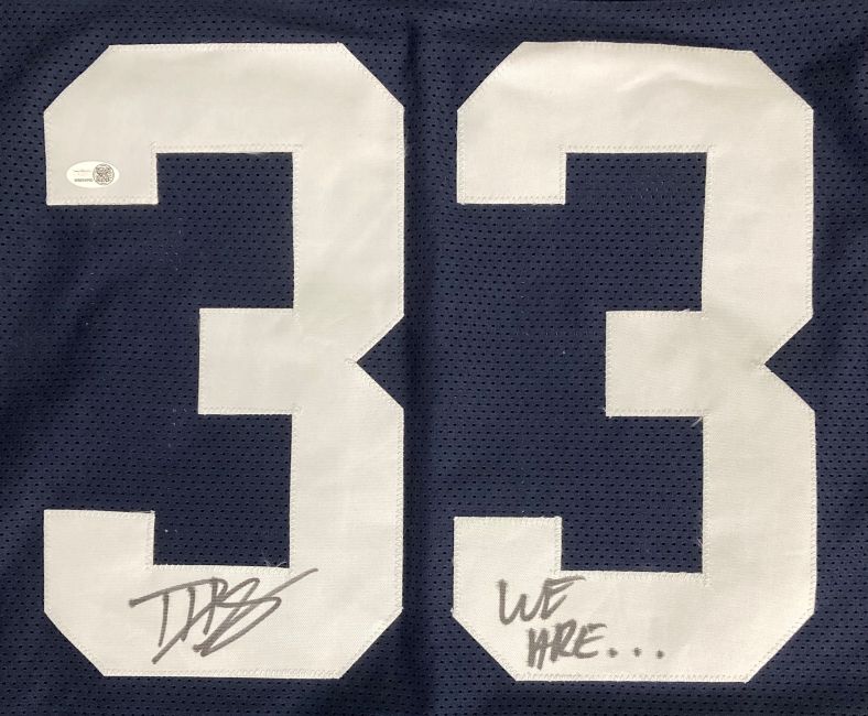 The Sports Integrity Dani Dennis-Sutton Penn State signed blue football jersey features large white number 33, with his signature on the left and "WE ARE..." handwritten on the right. Authenticated by JSA QR Holo.