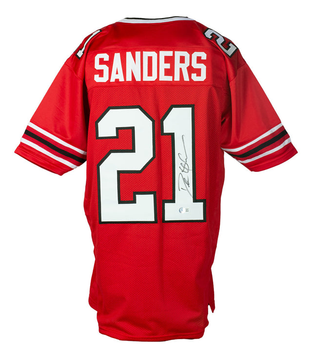 Deion Sanders Signed Custom Red Pro Style Football Jersey by Sports Integrity. Featuring black and white number 21, “Sanders” on the back, and a BAS ITP authenticated autograph in black marker on the number 1.