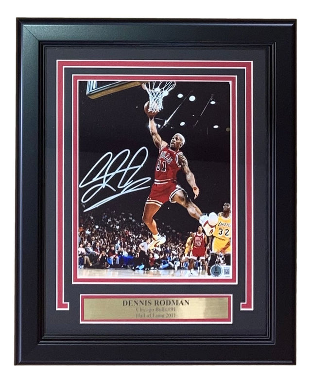 Sports Integrity Dennis Rodman Signed Framed 8x10 Chicago Bulls Photo BAS features a framed, autographed game-action shot of Rodman (#91), perfect for fans and collectors.