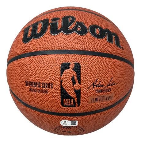 A close-up of a Sports Integrity Dennis Rodman Chicago Bulls Signed NBA Wilson I/O Basketball BAS shows its textured orange surface, black seams, autograph, NBA logo, model details, and a barcode sticker at the bottom.