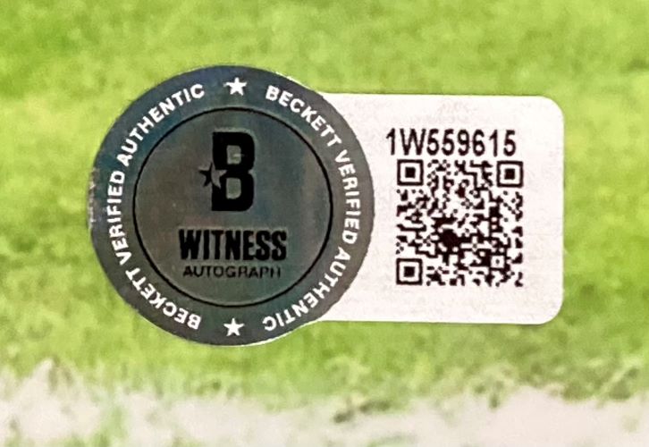 This Derrick Henry Signed 16x20 Baltimore Ravens Purple Jersey Photo by Sports Integrity features a Beckett Witness Autograph sticker with QR code and serial number 1W559615, reading "Beckett Verified Authentic" around the edge and "Witness Autograph" in the center.