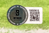 This Derrick Henry Signed 16x20 Baltimore Ravens Purple Jersey Photo by Sports Integrity features a Beckett Witness Autograph sticker with QR code and serial number 1W559615, reading "Beckett Verified Authentic" around the edge and "Witness Autograph" in the center.