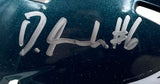 Close-up of a dark green, shiny Devonta Smith Signed Eagles Mini Speed Helmet by Sports Integrity, featuring "D.A. #6" and displayed in a Fanatics Super Bowl 59 LIX case.