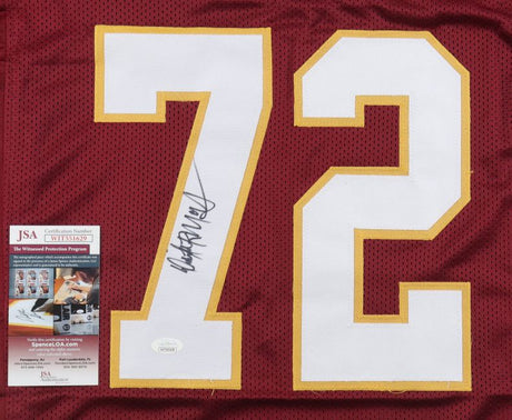 The Sports Integrity Dexter Manley Washington Signed Burgundy Football Jersey features a white number 72, yellow trim, black autograph, and comes with a JSA authentication card beside the number.