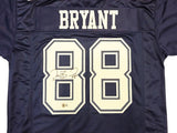 The Sports Integrity Dez Bryant Dallas Signed Navy Blue Football Jersey features BRYANT and number 88 in white, with the 88 autographed in black marker.