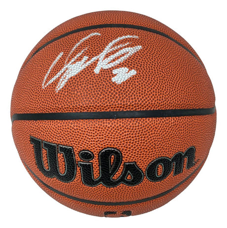 A Dominique Wilkins Atlanta Hawks signed NBA Wilson I/O basketball from Sports Integrity, featuring black text, a textured surface, and a white signature on the top panel.