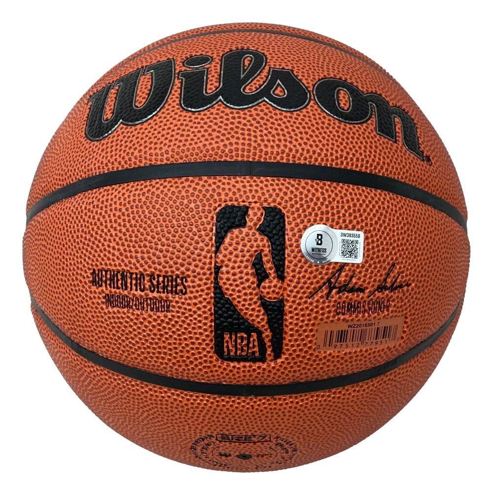 The Sports Integrity Dominique Wilkins Atlanta Hawks Signed NBA Wilson I/O Basketball features a textured orange surface, black logo, NBA silhouette, signature, barcode, and two stickers for details and authenticity.