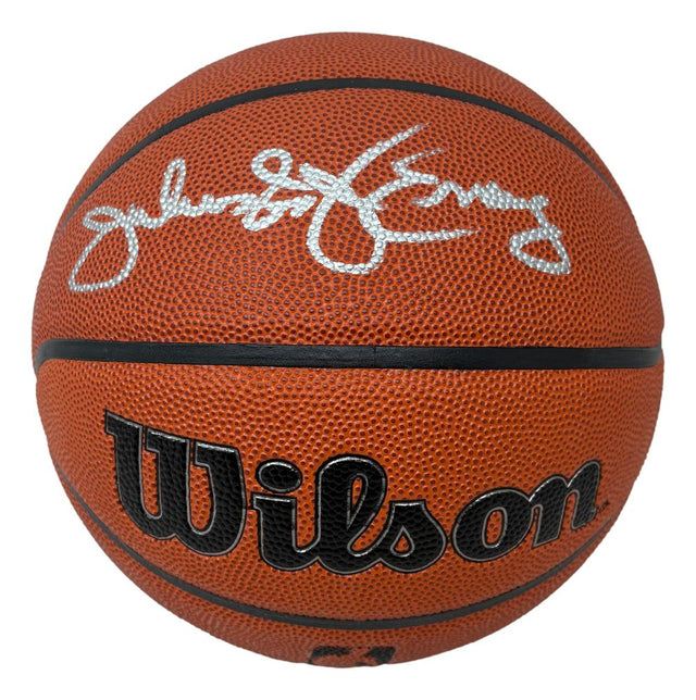 A Julius Dr. J Erving Philadelphia 76ers Signed Wilson I/O Basketball by Sports Integrity features a black textured surface, prominent Wilson branding, and an autograph in silver marker on the top panel.