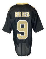 Sports Integrity Drew Brees New Orleans Signed Black Football Jersey BAS featuring gold and white details, with "BREES" and the number 9 on the back.