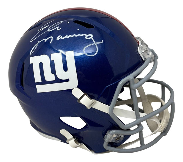 The Eli Manning Signed New York Giants Full Size Speed Replica Helmet by Sports Integrity features a blue helmet with a white "ny" logo and autograph on top.