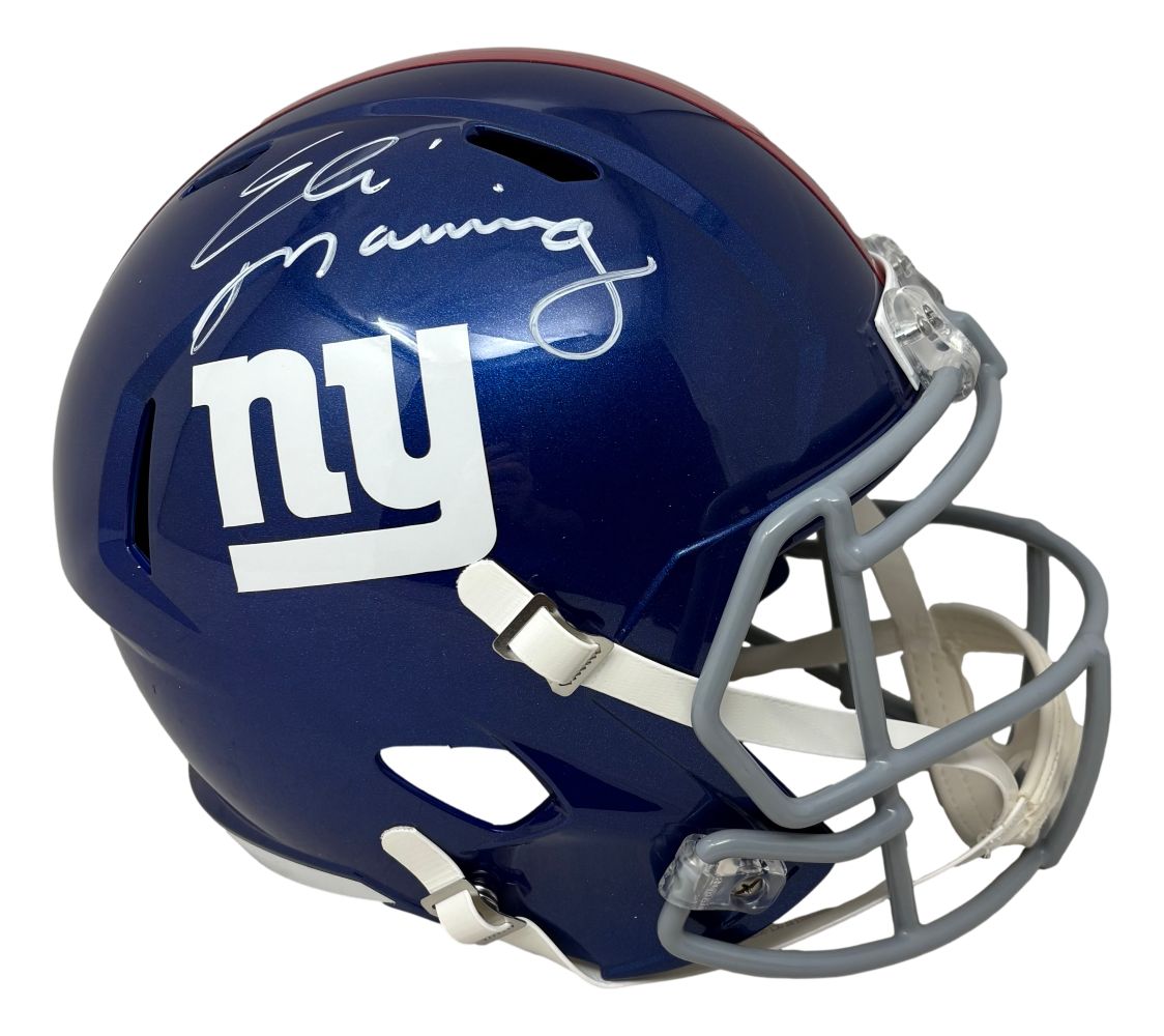 The Eli Manning Signed New York Giants Full Size Speed Replica Helmet by Sports Integrity features a blue helmet with a white "ny" logo and autograph on top.