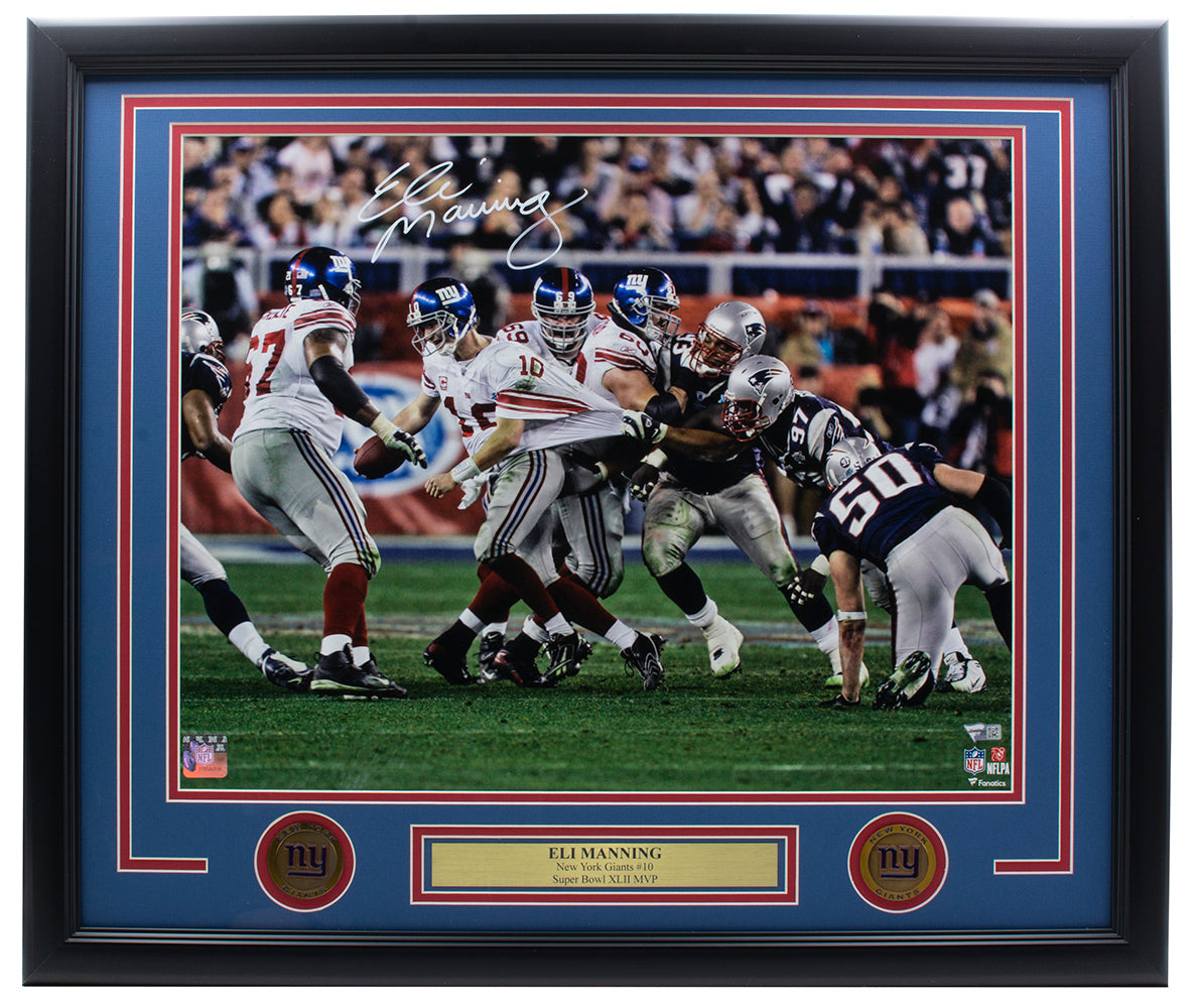Eli Manning Signed Framed 16x20 New York Giants SB XLII Escape Photo by Sports Integrity features his autograph and team logos, capturing a legendary football moment.
