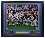 Eli Manning Signed Framed 16x20 New York Giants SB XLII Escape Photo by Sports Integrity features his autograph and team logos, capturing a legendary football moment.