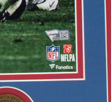 Close-up of the Eli Manning Signed Framed 16x20 New York Giants SB XLII Escape Photo by Sports Integrity, featuring Fanatics, NFL, and NFLPA logos, a QR code, and part of a football field with players' legs visible at the bottom.