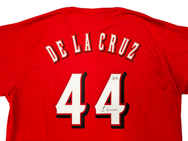 The Sports Integrity Elly De La Cruz Cincinnati Signed Red Baseball Jersey features "DE LA CRUZ" and number 44 in white and black, with the autograph above the lower 4. BAS authenticated.