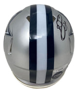 The Sports Integrity Emmitt Smith Signed Dallas Cowboys Mini Speed Replica Helmet JSA features a silver design with a dark blue and white center stripe, team logo on the side, and Emmitt Smith’s autograph on the back right.