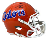 A full-size orange Florida Gators Speed Replica helmet by Sports Integrity, with "Gators" in blue and white script, a white faceguard, and Emmitt Smith's black signature on top. Includes Prova hologram authentication.