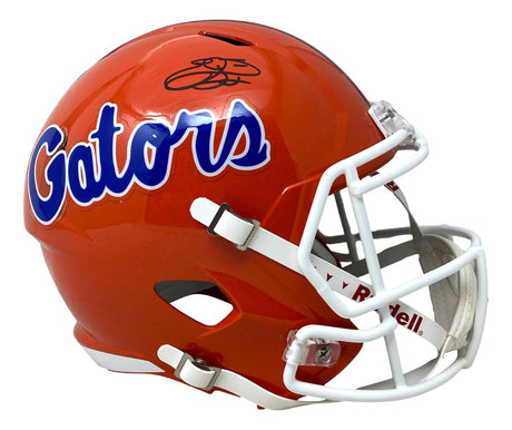 A full-size orange Florida Gators Speed Replica helmet by Sports Integrity, with "Gators" in blue and white script, a white faceguard, and Emmitt Smith's black signature on top. Includes Prova hologram authentication.