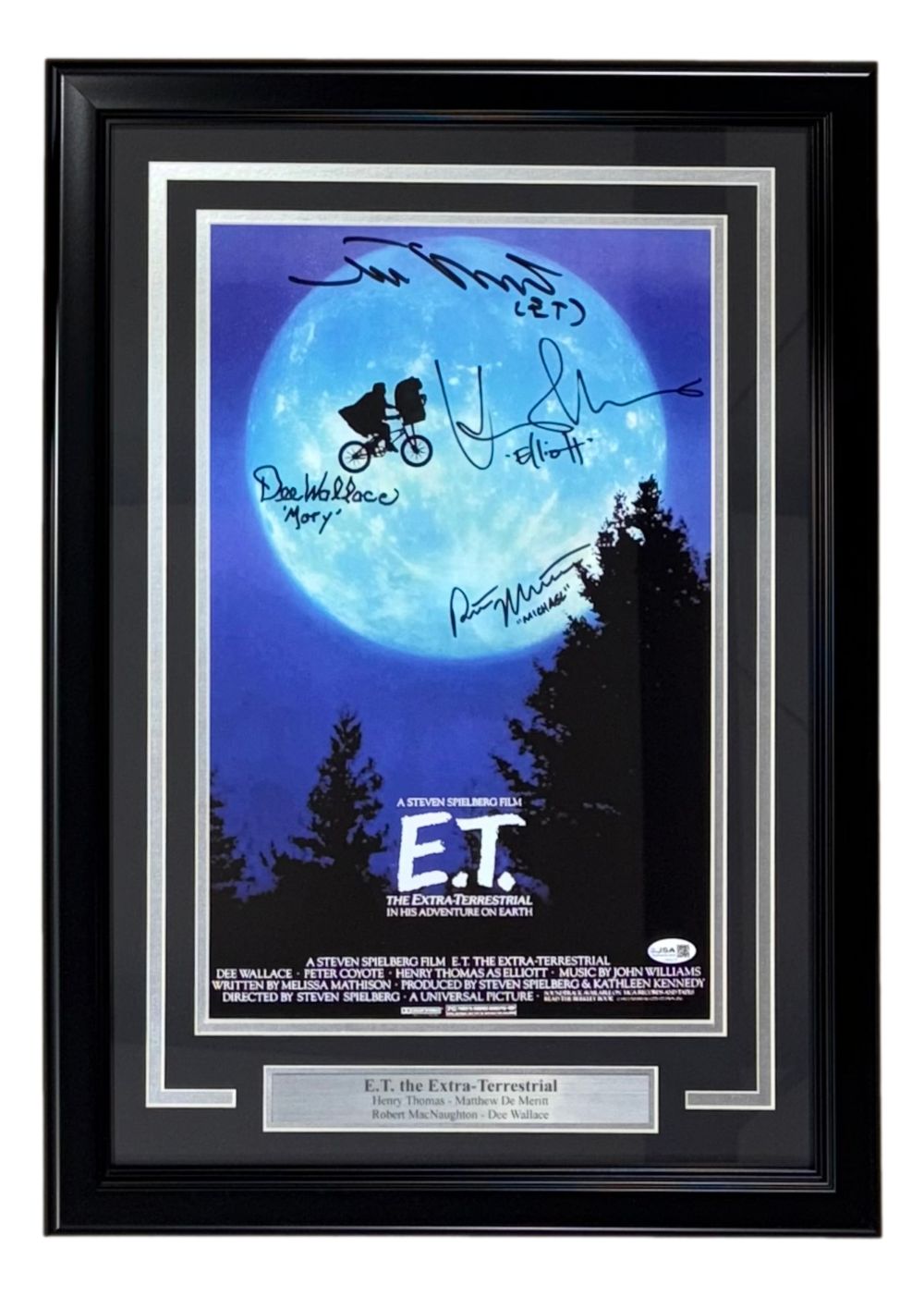 The Sports Integrity ET Cast (4) Signed Framed 11x17 Photo features Henry Thomas, De Merritt & more, with JSA authentication—showcasing a moonlit bicycle scene in a white-matted frame with silver nameplate.