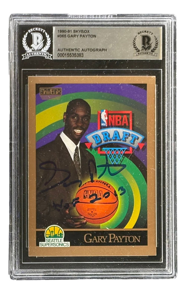 The Sports Integrity Gary Payton Signed 1990/91 Skybox #365 Seattle Sonics Rookie Card HOF 2013 BAS features his autograph and is encased in a Beckett authentication holder.