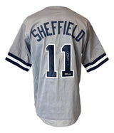 The Gary Sheffield New York gray baseball jersey by Sports Integrity features blue and white striped sleeves, "SHEFFIELD" and number 11 on the back, with the number 11 autographed.
