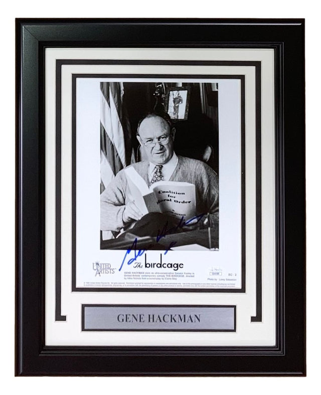 Gene Hackman Signed Framed 8x10 “The Birdcage” Photo by Sports Integrity, authenticated by JSA, featuring a black-and-white image of Hackman reading, with name plaque and "The Birdcage" (1996) label.