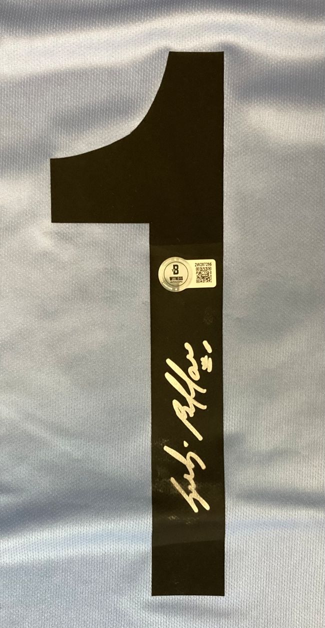 A Gianluigi Buffon signed Juventus Lotto blue soccer jersey from Sports Integrity features a black number 1 on light blue fabric, a white signature, and a Beckett authentication sticker above the autograph.