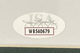 A close-up of the oval WB540679 sticker, featuring bold black text over a faint JSA logo and signature, authenticates the Sports Integrity Brandon Graham Signed Framed 16x20 Super Bowl 59 Eagles Smoke Photo.