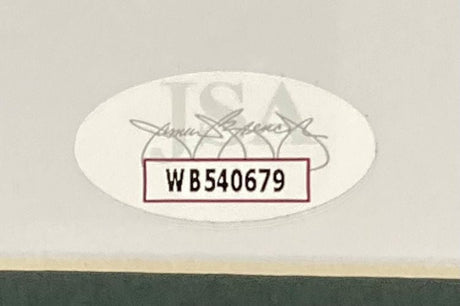 A close-up of the oval WB540679 sticker, featuring bold black text over a faint JSA logo and signature, authenticates the Sports Integrity Brandon Graham Signed Framed 16x20 Super Bowl 59 Eagles Smoke Photo.