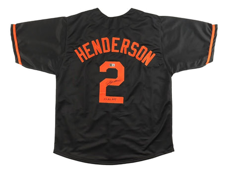 A black Gunnar Henderson Baltimore baseball jersey by Sports Integrity, featuring orange accents, his name and number 2 on the back signed and dated "23.2.14. HOF," commemorating his AL ROY award with BAS authentication.