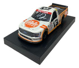 The Sports Integrity Hailie Deegan Signed 1:24 NASCAR Dible Dough Die-Cast Truck features the number 13, a “Dible Dough” logo on the hood, a white windshield signature, and is displayed on a black platform.