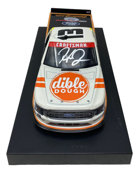 The Sports Integrity Hailie Deegan Signed 1:24 NASCAR Dible Dough Die-Cast Truck features "Craftsman" on the windshield, "Dible Dough" on the hood, a large white autograph, and is displayed on a black base.