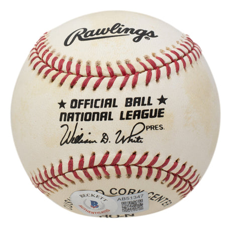 A Hank Aaron signed Milwaukee Braves National League baseball by Sports Integrity, featuring red stitching, the league president’s signature, and BAS LOA authentication code AB51347.