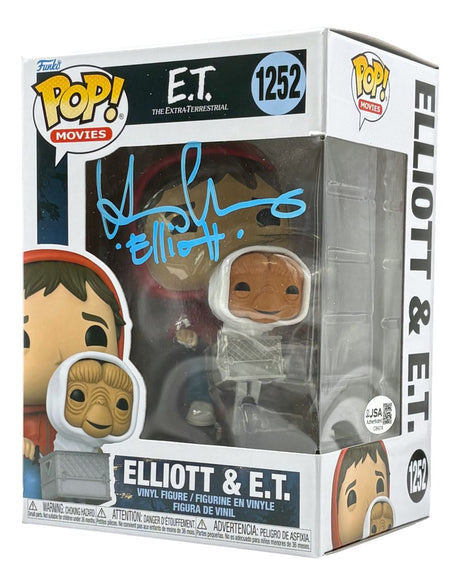 The Sports Integrity Henry Thomas Signed ET Funko Pop #1252 (JSA) features both vinyl figures in-box, with the packaging signed in blue marker.