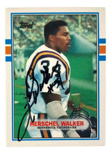 The Sports Integrity Herschel Walker Signed 1989 Topps #120T Minnesota Vikings Trading Card BAS features him in uniform as a running back, holding his helmet on the field, with his name and team shown.