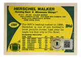 The Herschel Walker Signed 1989 Topps #120T Minnesota Vikings Trading Card by Sports Integrity features stats, career highlights, team info on the back, yellow and green accents, and a BAS certification sticker.