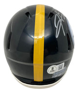 The Sports Integrity Hines Ward Signed Pittsburgh Steelers Mini Speed Replica Helmet features a dark design with a yellow center stripe, visible sticker, and Hines Ward’s autograph in white marker on the top right.